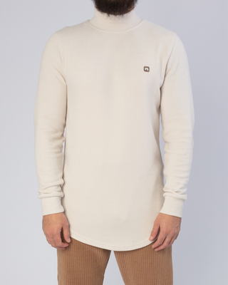 Col roulé beige de Qaba'il