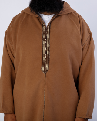 Details van een djellaba man